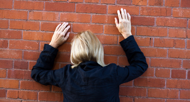 woman hitting the wall